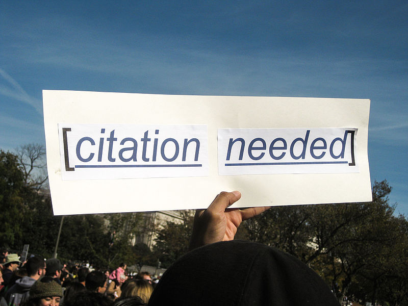 a sign reads [citation needed]